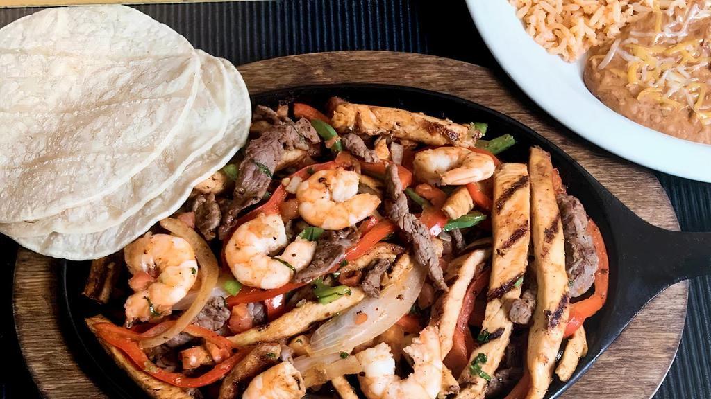 Mixed Fajita · Choice of any two (steak, chicken, or shrimp) with onions, bell peppers, and warm flour or corn tortillas.