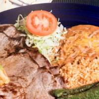 Carne Asada Plate · Marinated thin sirloin steak broiled to perfection and served with warm flour or corn tortil...
