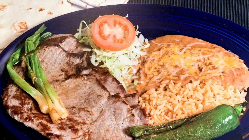 Carne Asada Plate · Marinated thin sirloin steak broiled to perfection and served with warm flour or corn tortillas.