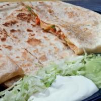 Fajita Quesadilla · Melted cheese, choice of meat, lettuce, tomatoes, grilled onions and bell peppers - served w...