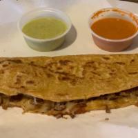 Machete Quesadilla · Hand Made ten inch corn tortilla with cheese and choice of meat.