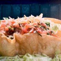 Taco Salad · Crispy corn tortilla topped with beans, cheese, lettuce, pico de gallo, and choice of meat, ...