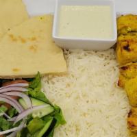 Chicken Kabob · 6 piece chicken breast kabob over white basmati rice and 1 fresh cut pita and side salad and...