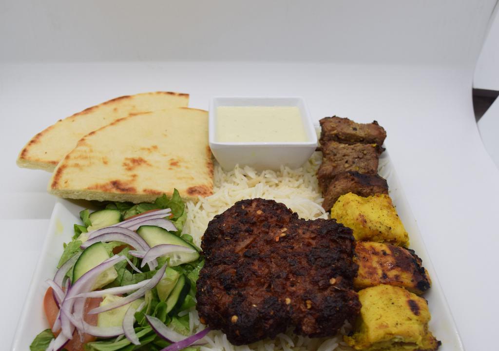 Combo Plate Kabob · 3 piece chicken breast 3 piece steak and 1 chapli kabob over white basmati rice and 1 fresh cut pita and side salad and also includes white and chutney sauce on side.