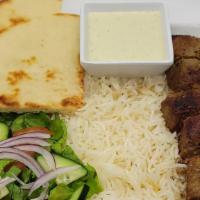 Steak Kabob · 6 piece steak kabob over white basmati rice and 1 fresh cut pita and side salad and also inc...
