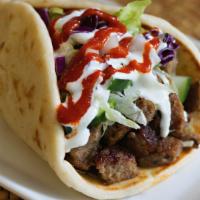 Lamb Gyro · All gyros come with lettuce tomato onions cucumber white sauce and hot sauce.