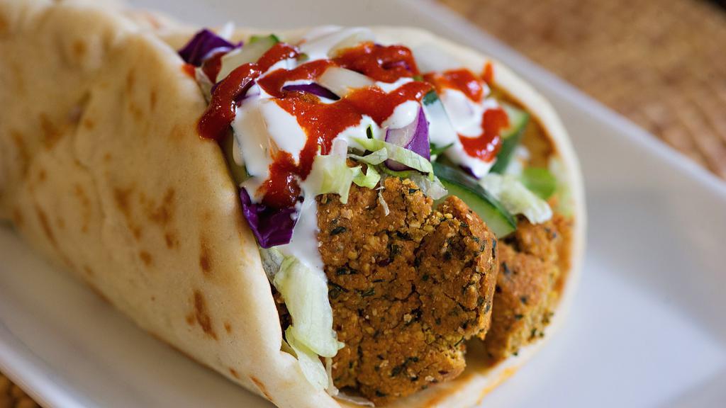 Falafel Gyro · All gyros come with lettuce tomato onions cucumber white sauce and hot sauce.