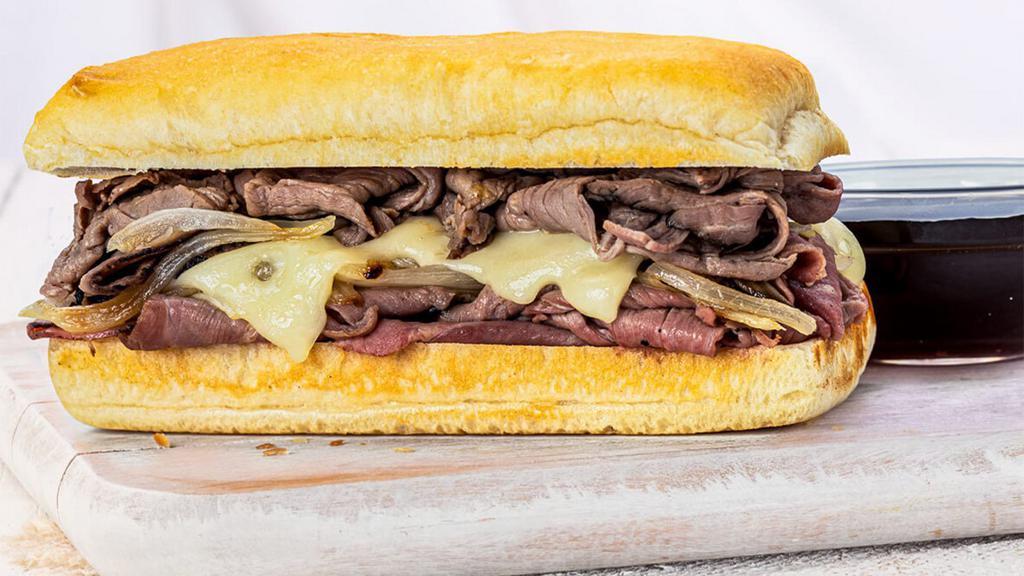 French Dip · Roasted beef, swiss and sautéed onions, served with au jus.