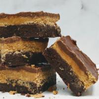 Peanut Butter Chocolate Brownie · | LAYERS | Peanut butter milk chocolate glaze + peanut butter filling
| BASE | Chocolate bro...