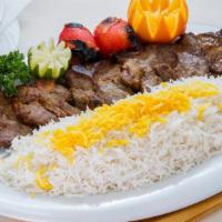 Lamb Chop · Charbroiled lamb chop marinated in hatam’s special sauce, served with charbroiled tomato and...