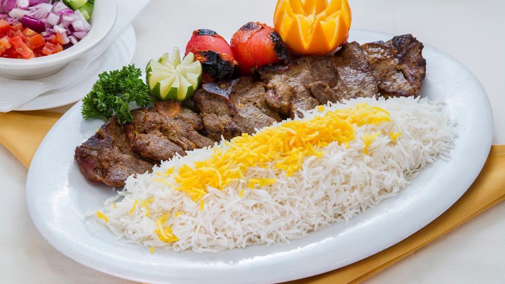 Lamb Chop · Charbroiled lamb chop marinated in hatam’s special sauce, served with charbroiled tomato and imported basmati rice topped with saffron.