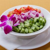 Shirazi Salad · Vegetarian. Combination of fresh chopped cucumbers, tomatoes, parsley, onions with virgin ol...