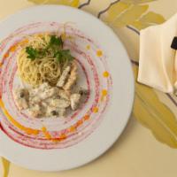 Calamari Picatta · Sliced pacific calamari steak sautéed with French shallots served with angel hair pasta in a...