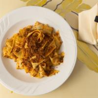 Pappardelle Bolognese · Extra-large, fettuccine pasta with a traditional bolognese sauce.