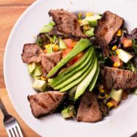 Tri-Tip Salad · Spring mix lettuce, avocado, cherry tomato, black beans, cheddar and jack cheese. Sliced gri...