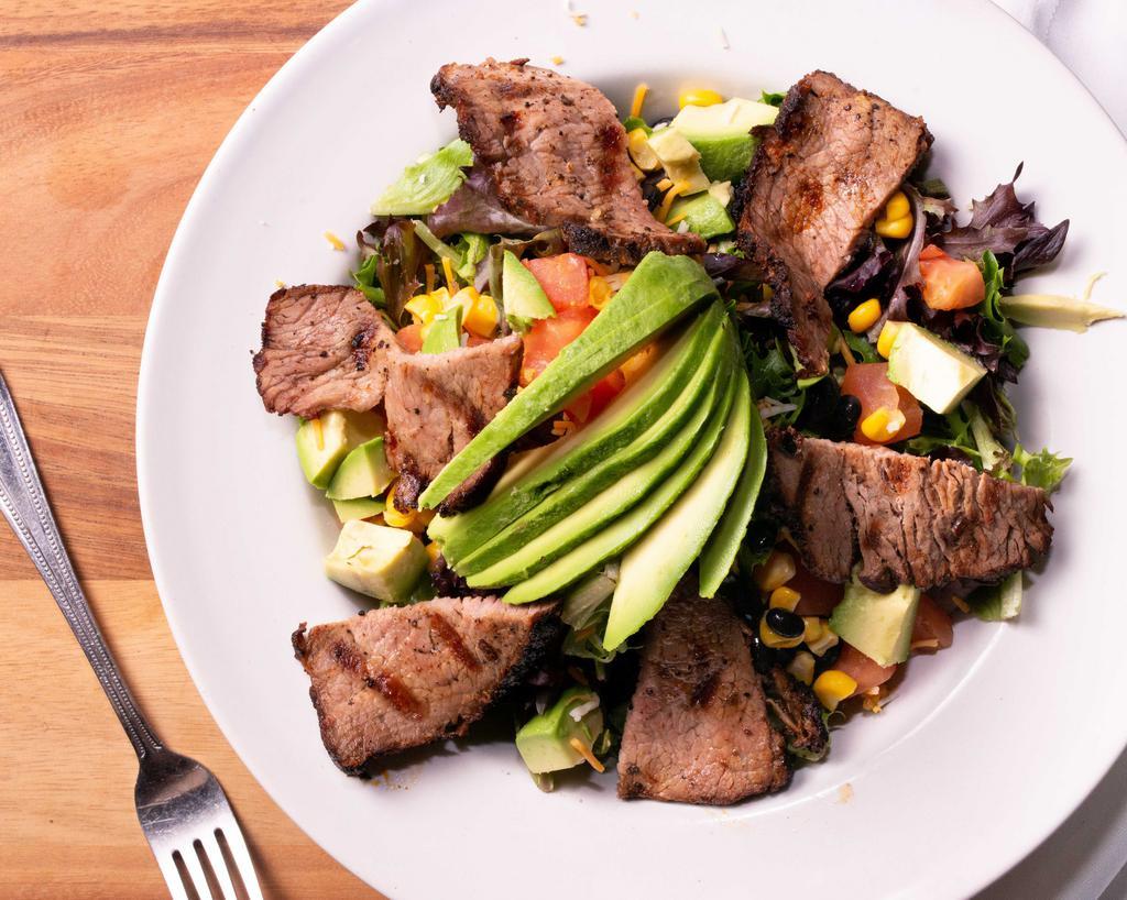 Tri-Tip Salad · Spring mix lettuce, avocado, cherry tomato, black beans, cheddar and jack cheese. Sliced grilled tri-tip.