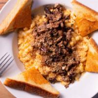 Stacked Mac & Cheese · A creamy blend of three cheeses, topped with pulled pork or hot links. Topped with baked bre...