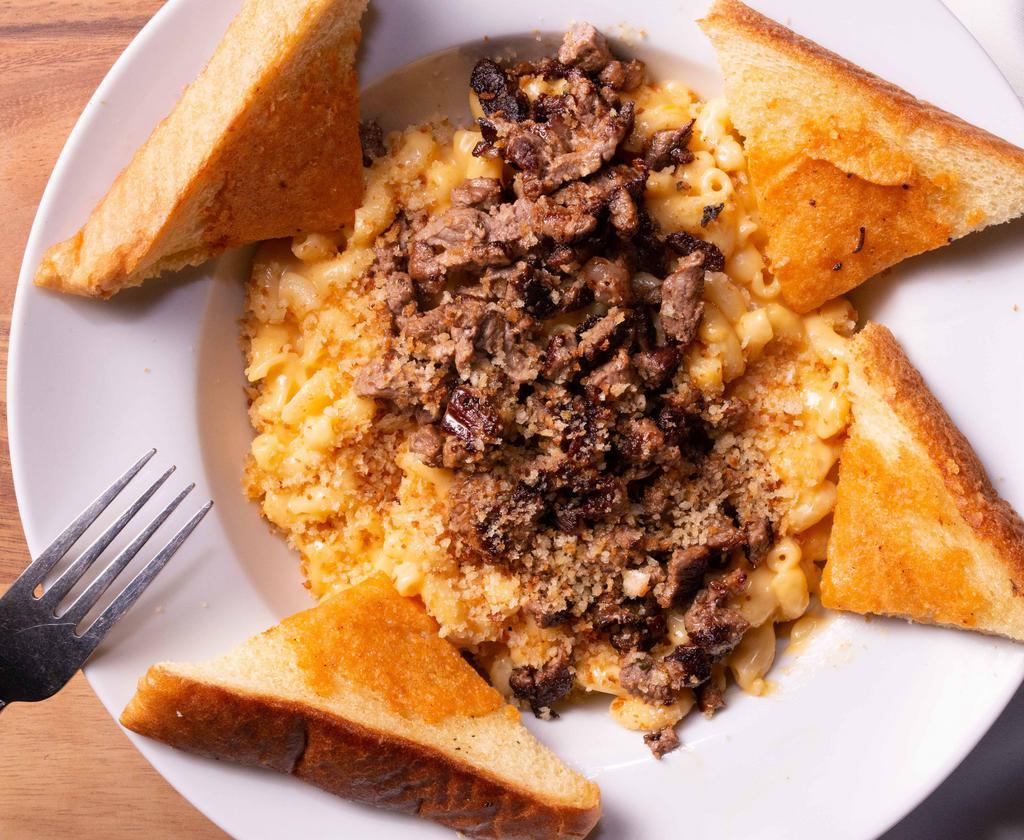Stacked Mac & Cheese · A creamy blend of three cheeses, topped with pulled pork or hot links. Topped with baked bread crumbs.