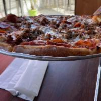 Meat Lovers · Pepperoni, bacon, Italian sausage, smoked ham and ground beef.