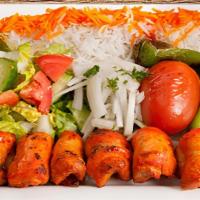 Chicken Thigh Plate · Marinated, tender chicken thigh grilled. Served with rice, garden salad, grilled tomato and ...