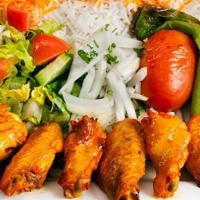 Chicken Wings Plate · Marinated, tender chicken wings grilled. Served with rice, garden salad, grilled tomato and ...