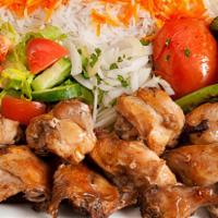 Chicken Cornish Plate · Marinated, tender chicken cornish grilled. Served with rice, garden salad, grilled tomato an...