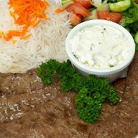 Gyro Plate · Served with rice, garden salad, grilled tomato and peppers, pita bread.