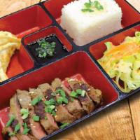 Steak Teriyaki Bento · Six ounces top sirloin, salad, white rice and chicken gyoza.