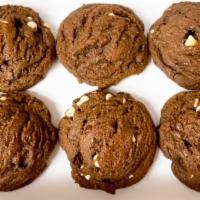 6 Triple Chocolate Cookies · A chocolate cookie filled with semi-sweet chocolate, dark chocolate and white chocolate. Per...