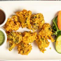Vegetable Pakoras · Mixed vegetables (baby spinach, baby cauliflower, potatoes) fried in chickpea bean flour.