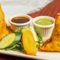 Vegetable Samosa (2 Pieces) · Pastry stuffed with potatoes, green peas and spices.