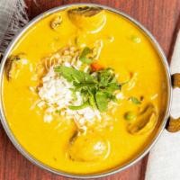 Vegetable Coconut Curry · Gluten free. Mix vegetables cooked with spices and coconut milk.