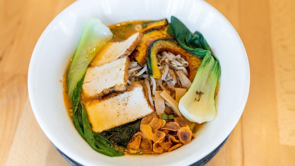 The Classic · Handcrafted triple-thick noodles and classic broth topped with bamboo shoots, wakame seaweed, no-chasiu tofu, crispy kabocha pumpki, sauteed bean sprouts, steamed bok choy, green onions, and garlic chips.