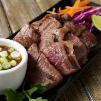 Crying Tiger · Grilled Filet Mignon(8oz) sliced served w/ steam vegetable and Thai spicy sauce