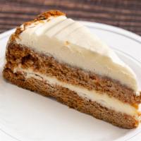Carrot Cake · Layer upon layer of moist carrot cake studded with raisins, walnuts and pineapple. Finished ...