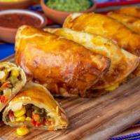 Veggie Empanada · Spinach, roasted corn, bell peppers, potato, cilantro, onions and pepper-jack cheese. Chimic...