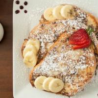 Coconut French Toast | 3 Slices · 3 slices garnished with strawberries, bananas, powdered sugar, + blueberry puree | vegan by ...