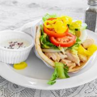 Chicken Wrap · Rotisserie chicken with rice, cabbage, lettuce, tomatoes, cucumbers, onions and pepper rings...