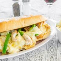 Chicken Philly Sandwich · Thin slices of lean roast chicken with grilled onions, green peppers and melted cheese on a ...
