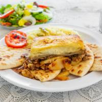 Moussaka · Baked Greek casserole consisting of layers of eggplant, seasoned ground beef and potatoes, w...