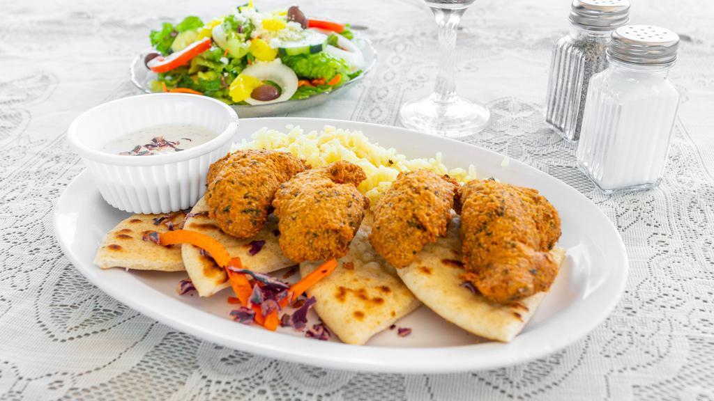 Falafel Plate · Garbanzo bean, sesame seed and herb patties, served with Greek salad, rice and pita bread.
