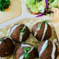 Falafel Plate · Served with Hummus, Salad, Rice Falafel drizzled with tahini and pita bread
