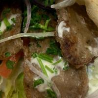Gyro Wrap · Gyro meat topped with Jajek wrapped with Lettuce, tomato