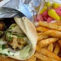 Chicken Kabob Wrap Combo · chicken kabob, with lettuce, tomato onions hummus wrapped with pita bread. 
Served with Frie...