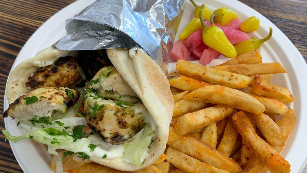 Chicken Kabob Wrap Combo · chicken kabob, with lettuce, tomato onions hummus wrapped with pita bread. 
Served with Fries and Soft Drink.