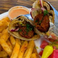 Chicken Lule Wrap · Chicken Lule wrapped with Lettuce, Tomato, Onions, Hummus. Wrapped with Pita Bread.