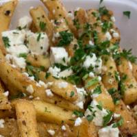 Garlic And Feta Fries · Fries seasoned with garlic and topped with feta cheese.