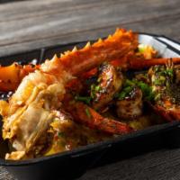 The Whole Shebang · Shredded marinated chicken with deep-fried crab legs, Cajun flavored sautéed lobster tail an...