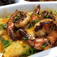 Chicken And Shrimp · Shredded chicken toped with Marinated shrimp with melted cheese
rolled in a special money gr...