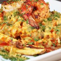 Chicken  And Shrimp · Shredded marinated chicken topped with shrimp melted cheese